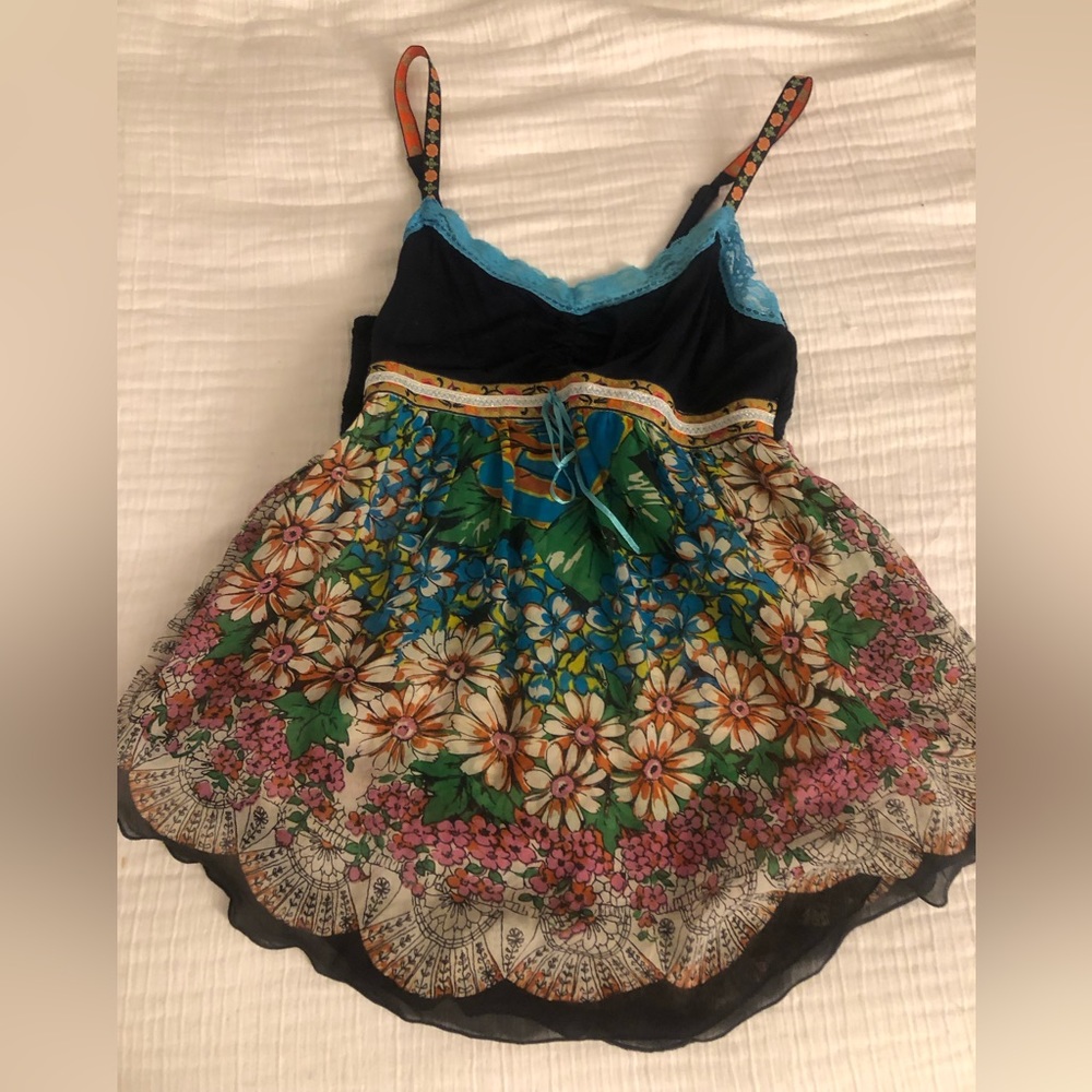 Free People tank top with flower detail straps.